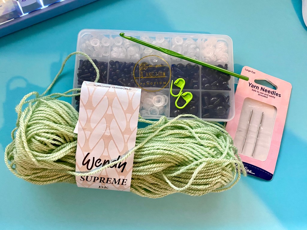 materials needed (yarn, Eyes, crochet hook and needles)