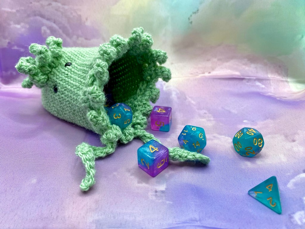 Cthulhu dice bag spilling out dice